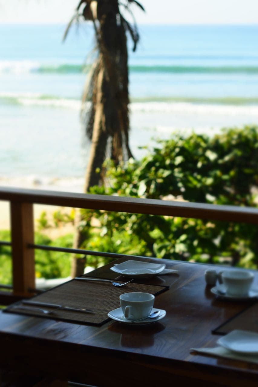 Morning coffee on a table overlooking the sea