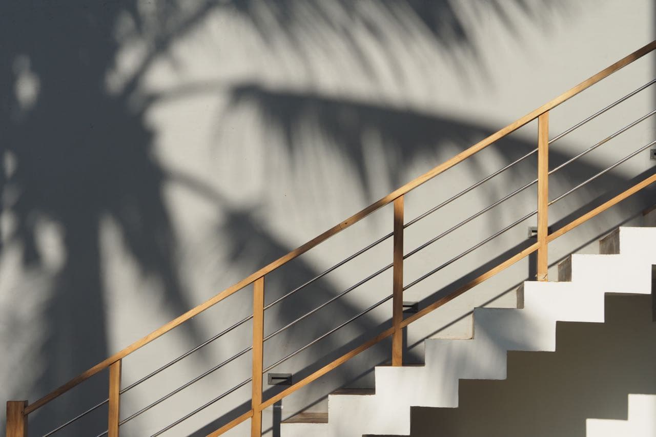 Light and shadow across the hotel staircase